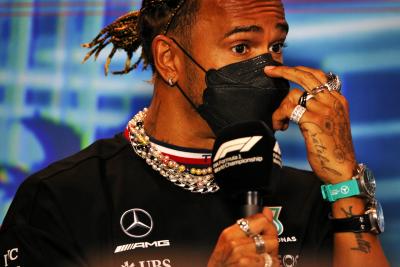 Lewis Hamilton protests the FIA's jewellery rules at the 2022 Miami GP / XPB Images