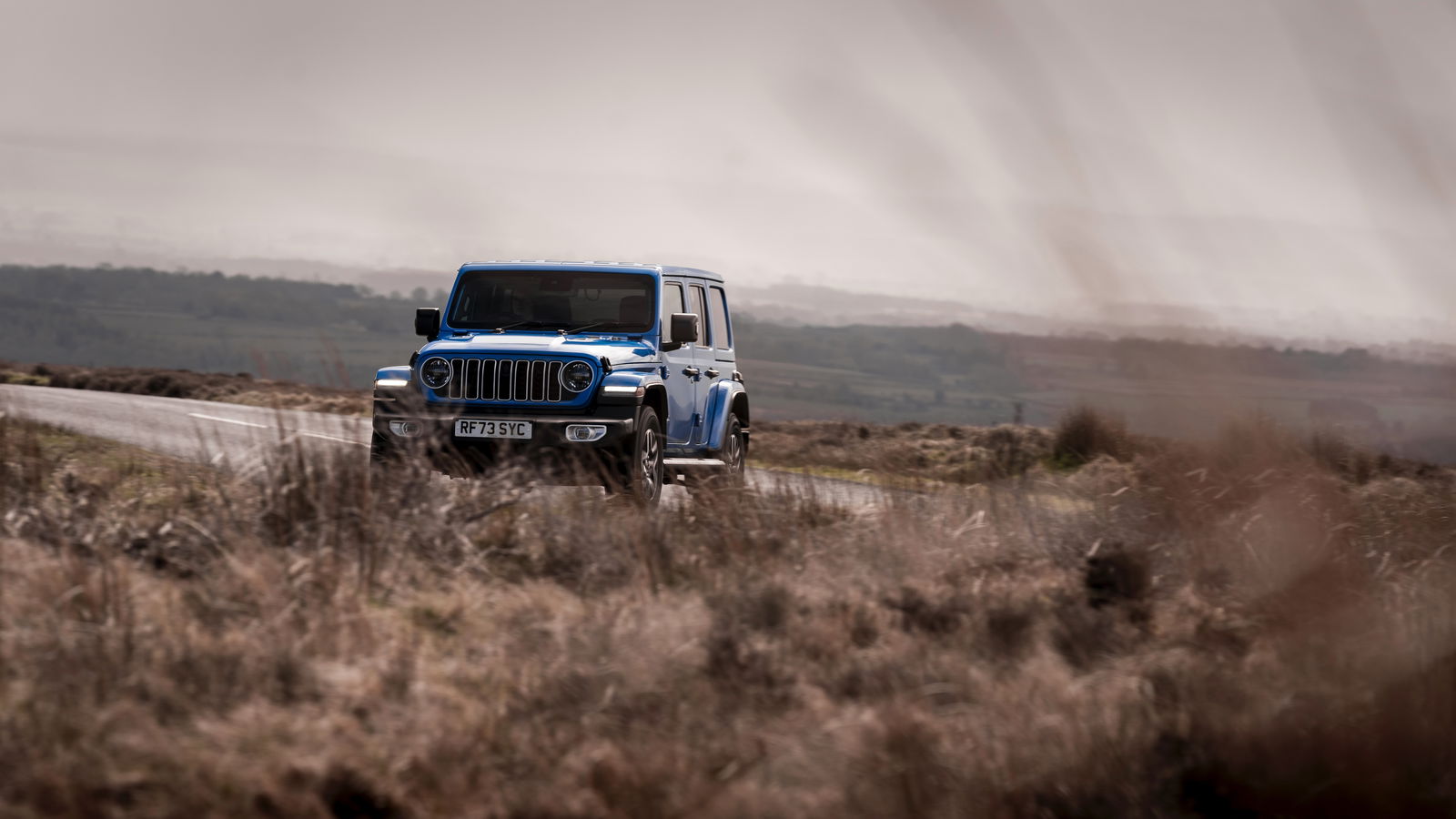 Jeep Wrangler - front, driving